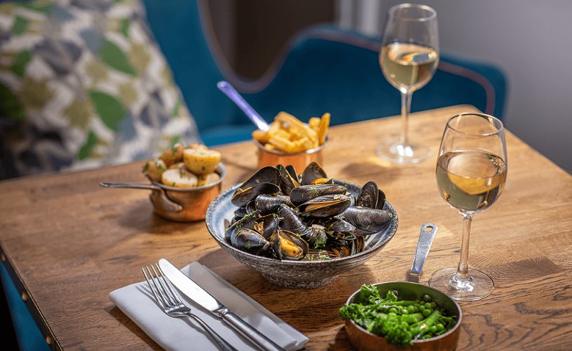 Mussels with sides and wine at The Harbour Kitchen